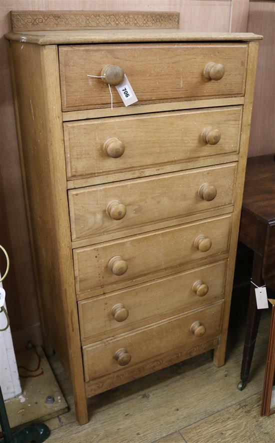 An oak tall chest of drawers W.63cm